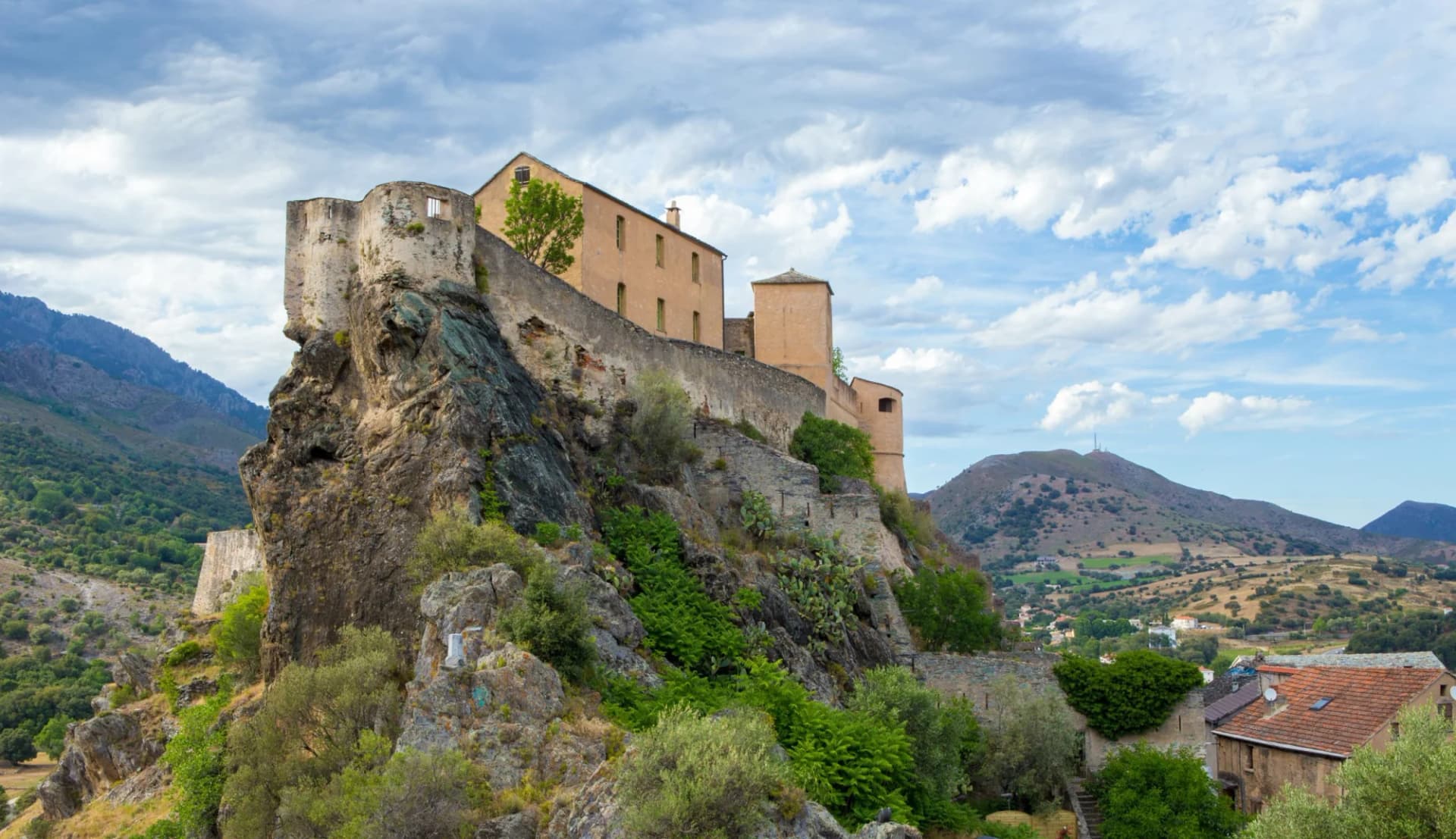 Fortress built on a rocky outcrop overlooking a valley in the old town of Corte.