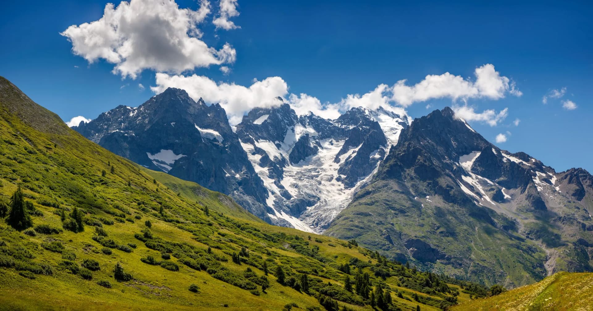 Snow-capped La Meije peak and Glacier du Lautaret in summer, Oisans Massif, Hautes-Alpes, France.