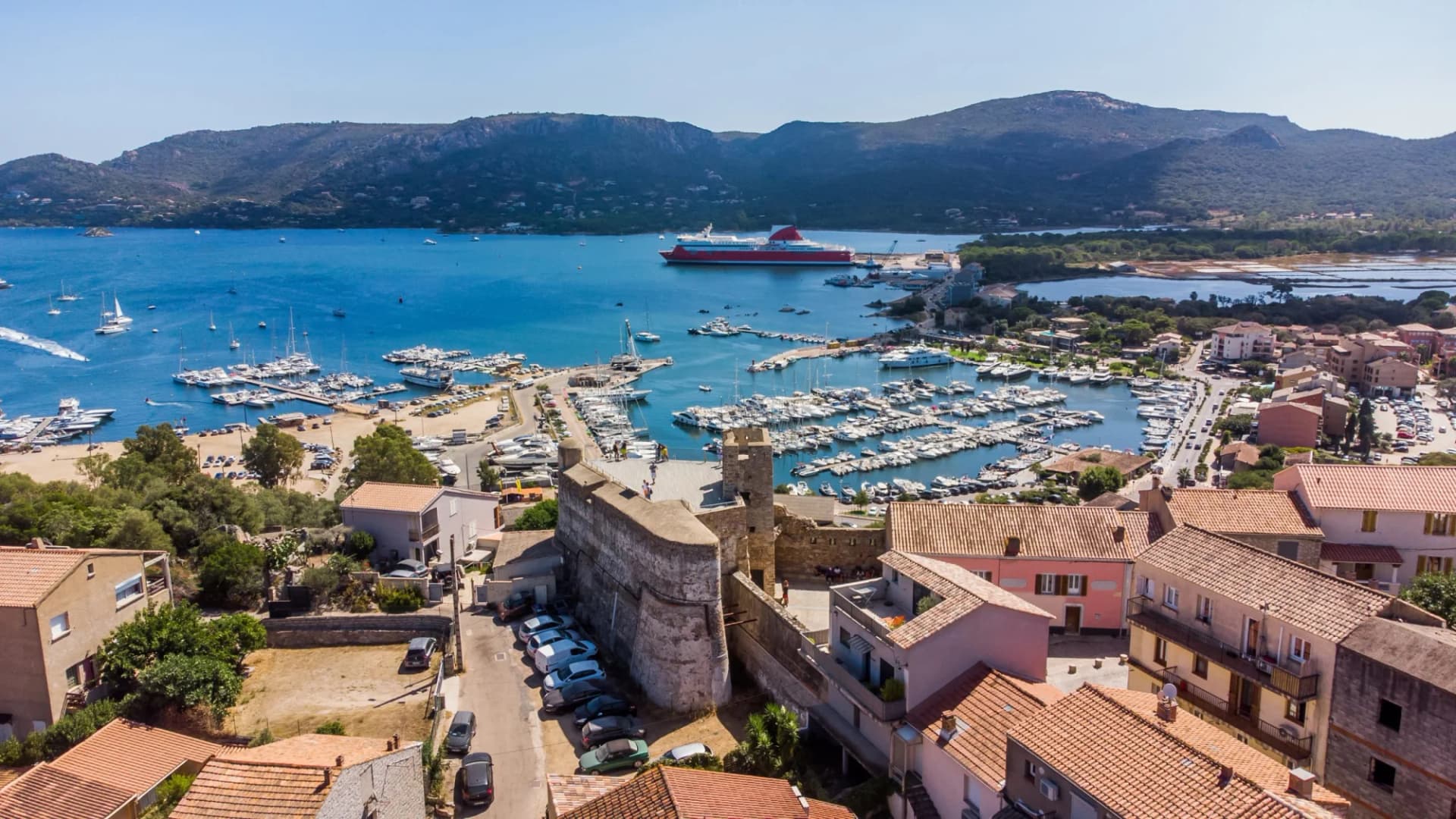 Aerial view of Bastion de France citadel, marina, and Mediterranean Sea in Porto Vecchio, Corsica.