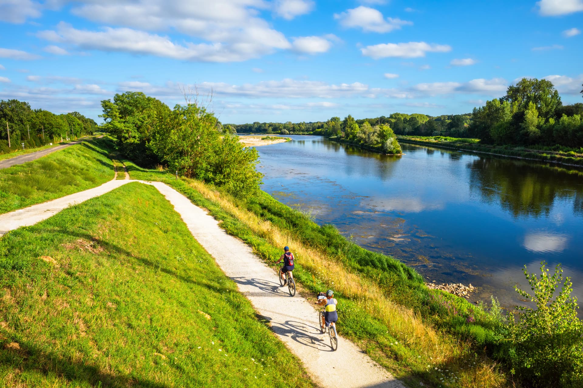 Chatilllon sur Loire, France. Cyclists ride along the Loire River in France.