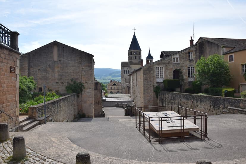 Cluny Abbey bell tower and historic stone buildings in France