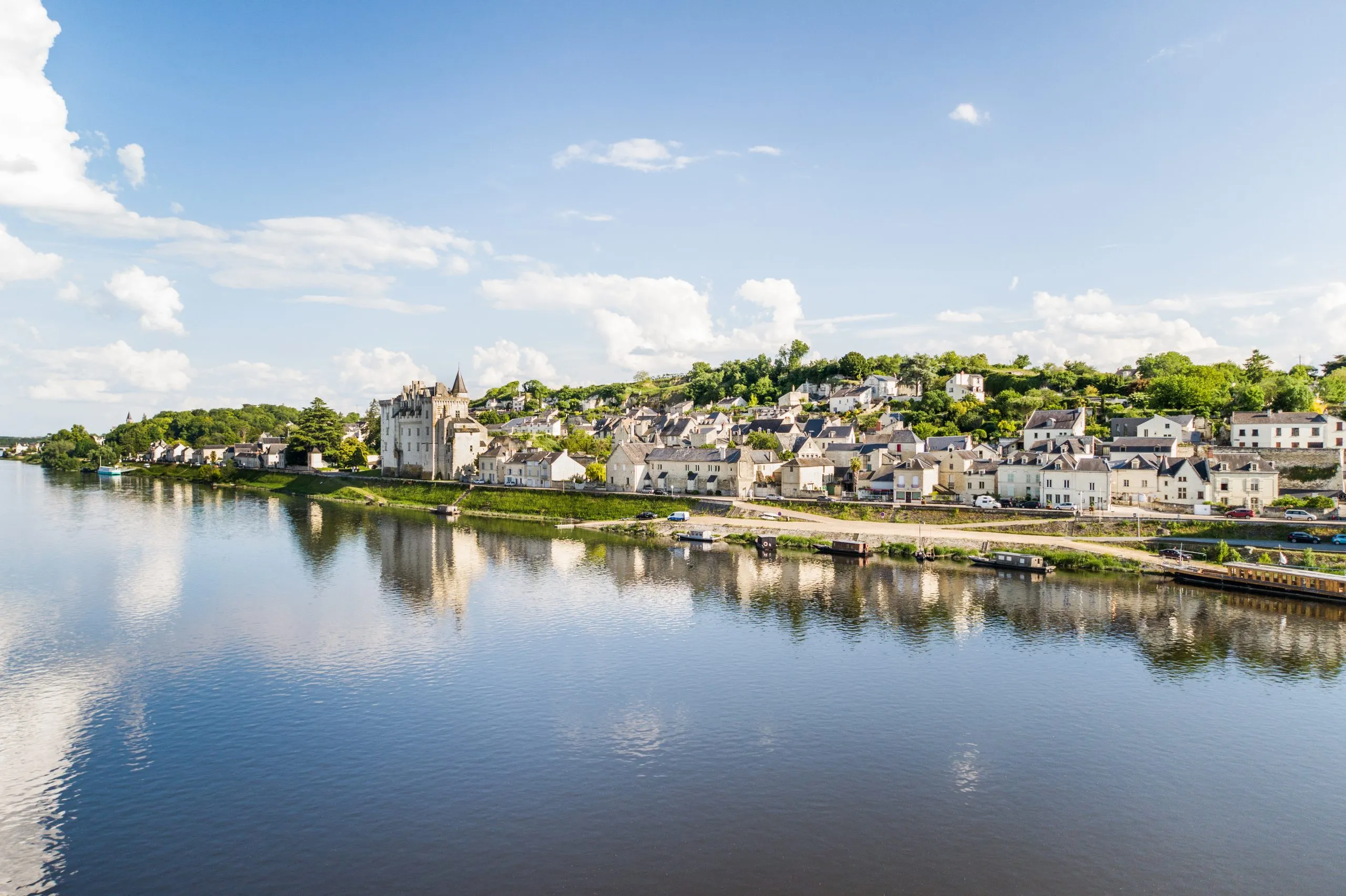 Aerial view with a drone of one of the most beautiful village of France : montsoreau in front of the river La Loire.